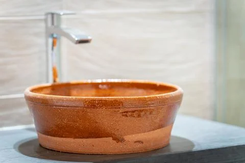 Rustic Clay Sink in Modern Bathroom Setting Stock Photos