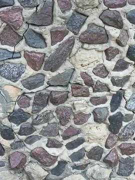 Rustic cobblestone stone wall texture background Stock Photos