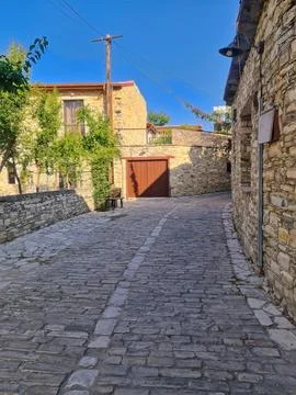 Rustic Cobblestone Street in Old Stone Village Stock Photos