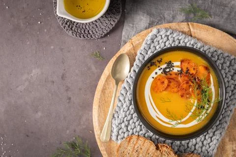 A rustic collection of flat lay and overhead shots featuring creamy carrot .. Foto stock