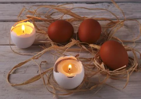Rustic composition with candles and eggs. Happy easter. Selective focus. Foto stock