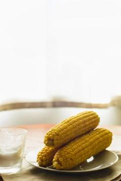 Rustic concept just cooked corn with salt on table Stock Photos