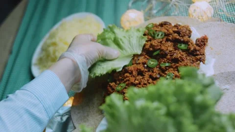 Rustic cooking view: building a colorful burrito Stock Footage 342167826
