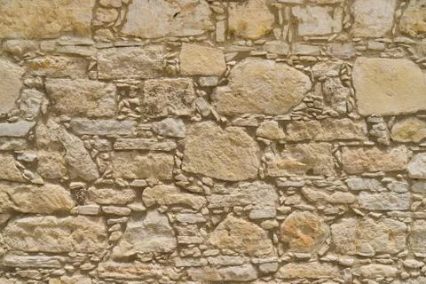 Rustic coquina Stone wall texture or background Stock Photos