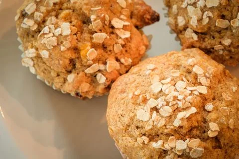 Rustic corn muffins with oats in close up view Stock Photos