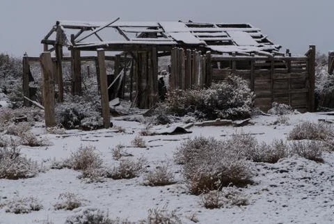 A rustic corral during a snow storm in the southwest. Stock Photos