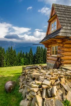 Rustic cottage in the mountains Stock Photos