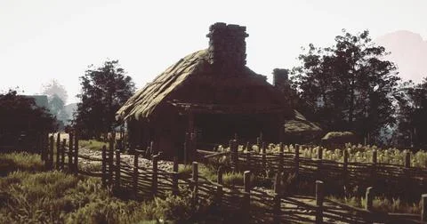 Rustic cottage surrounded by lush greenery and wooden fences at dusk Stock Illustration