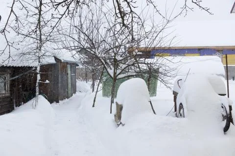 Rustic courtyard in the snow Stock Photos