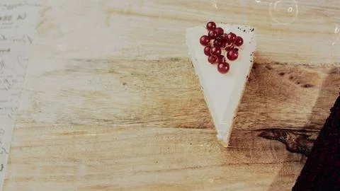 Rustic culinary presentation: framing red currants on a layered dessert 스톡 사진