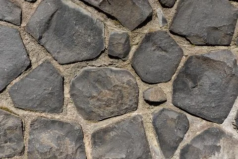 Rustic cyclopean masonry wall texture, irregular quarry stone background Stock-Fotos