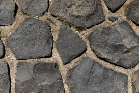 Rustic cyclopean masonry wall texture, irregular quarry stone background Stock-Fotos