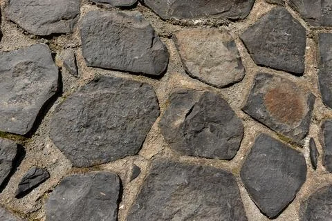 Rustic cyclopean masonry wall texture, irregular quarry stone background Stock-Fotos