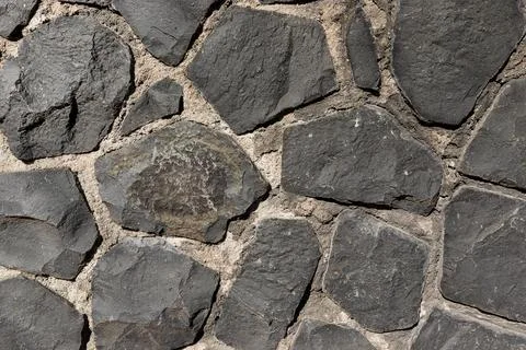 Rustic cyclopean masonry wall texture, irregular quarry stone background Stock-Fotos