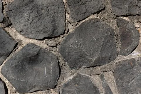 Rustic cyclopean masonry wall texture, irregular quarry stone background Фото