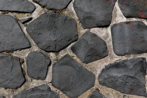 Rustic cyclopean masonry wall texture, irregular quarry stone background Fotos Stock