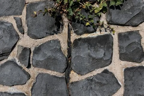 Rustic cyclopean masonry wall texture, irregular quarry stone background Stock-Fotos