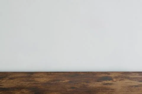 Rustic dark wood tabletop with blurred white background. 스톡 사진