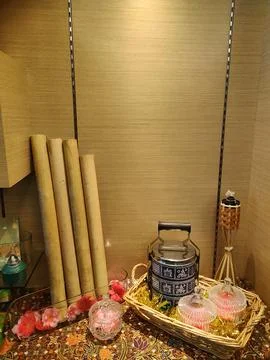 Rustic Decor with Bamboo Rolls, Traditional Vessel, and Decorative Elements.. 스톡 사진