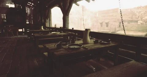 Rustic dining area in an ancient building overlooking a scenic landscape Ilustración de archivo