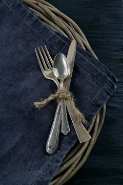 Rustic dinner setting with dark napkin Foto stock