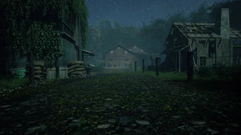 A rustic dirt road passes old buildings, trees, and a water tower Stock Footage 309071264