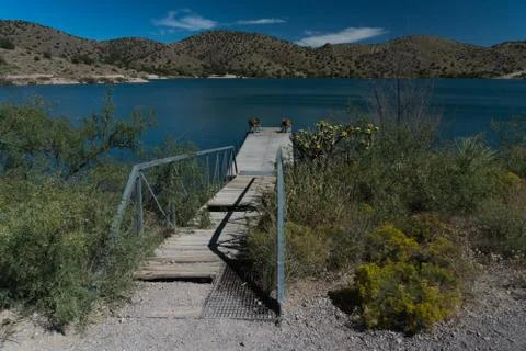 A rustic dock view at Bill Evans lake, New Mexico. Stock Photos