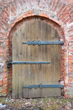Rustic Door in Brick Archway Stock Photos