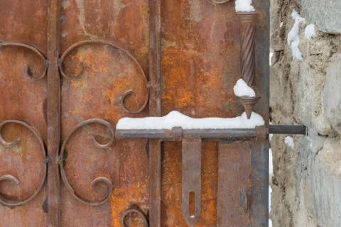 Rustic door lock snow covered Stock Photos