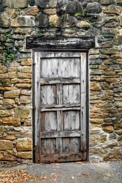 Rustic Door in Stone Wall Stock Photos