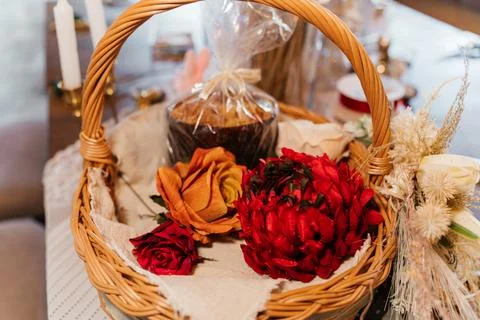 Rustic Easter craft table with wicker basket, dried flowers, and handmade Stock Photos