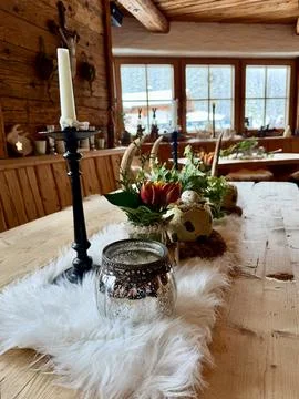 Rustic Easter table decor in a cozy wooden mountain cabin Stock Photos