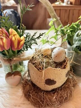 Rustic Easter table decor in a cozy wooden mountain cabin Stock Photos