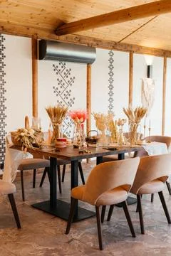 Rustic Easter-themed craft table decorated with dried flowers, wheat, and Stock Photos