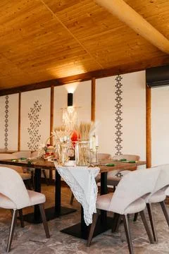 Rustic Easter-themed craft table decorated with dried flowers, wheat, and Stock Photos