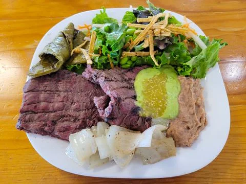 Rustic Elegance: Steak and Nopal Delight with a Side of Fresh Salad Stock Photos