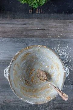 Rustic empty mixing bowl with peanut butter balls candy ingredients flat lay Stock Photos