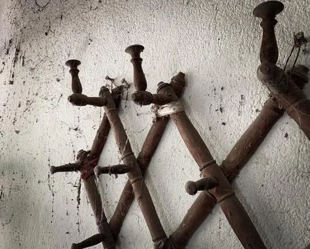Rustic empty wall hooks. Antique farmhouse wall hangers. Stock Photos