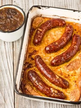 Rustic english pub grub toad in the hole Stock Photos