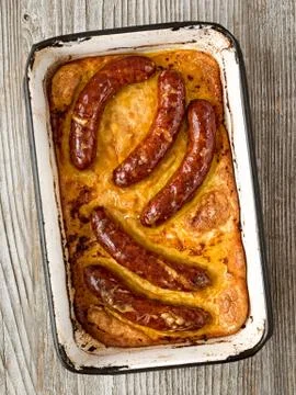 Rustic english pub grub toad in the hole Stock Photos