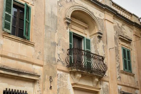 Rustic Facade with Green Shutters in Malta Stock Photos