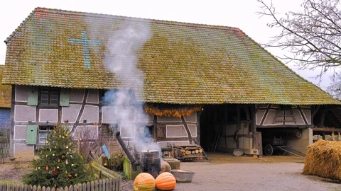 Rustic farm outdoor cooking steaming cauldron of pumpkin and vegetables Stock Footage 124473936