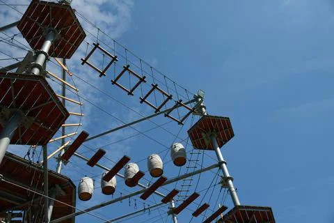 Rustic Ferris Wheel against Blue Sky in Vintage Amusement Park Stock Photos