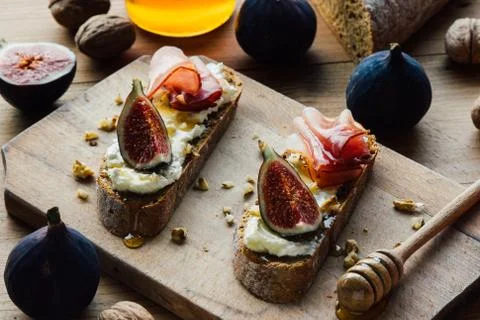 Rustic figs bruschetta Stock Photos