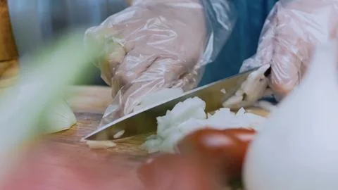 Rustic fine dining angle: cutting beef into pieces for stewing Stock Photos