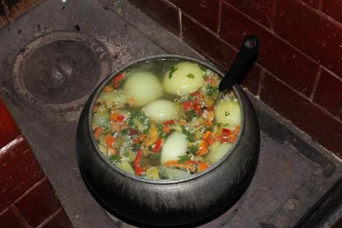 Rustic fish soup in cast-iron pan, healthy food Stock Photos