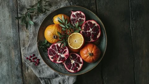 Rustic Flat Lay of Fresh Citrus and Pomegranate on Wooden Table Stock Footage 294506461