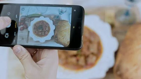 Rustic food styling scene: showing tender beef in tomato sauce Stock Photos