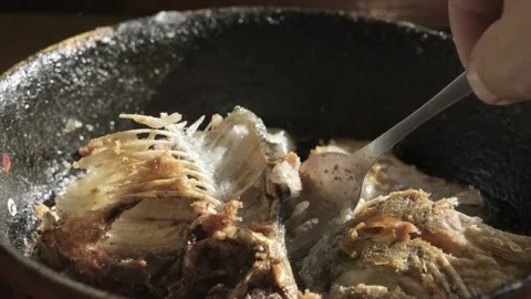 Rustic Fried Fish in Cast-Iron Skillet Stock Footage 303414342