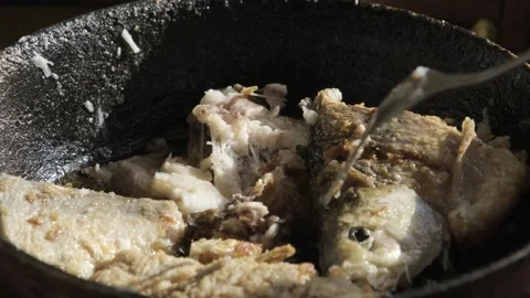 Rustic Fried Fish in Cast-Iron Skillet Stock Footage 303414404